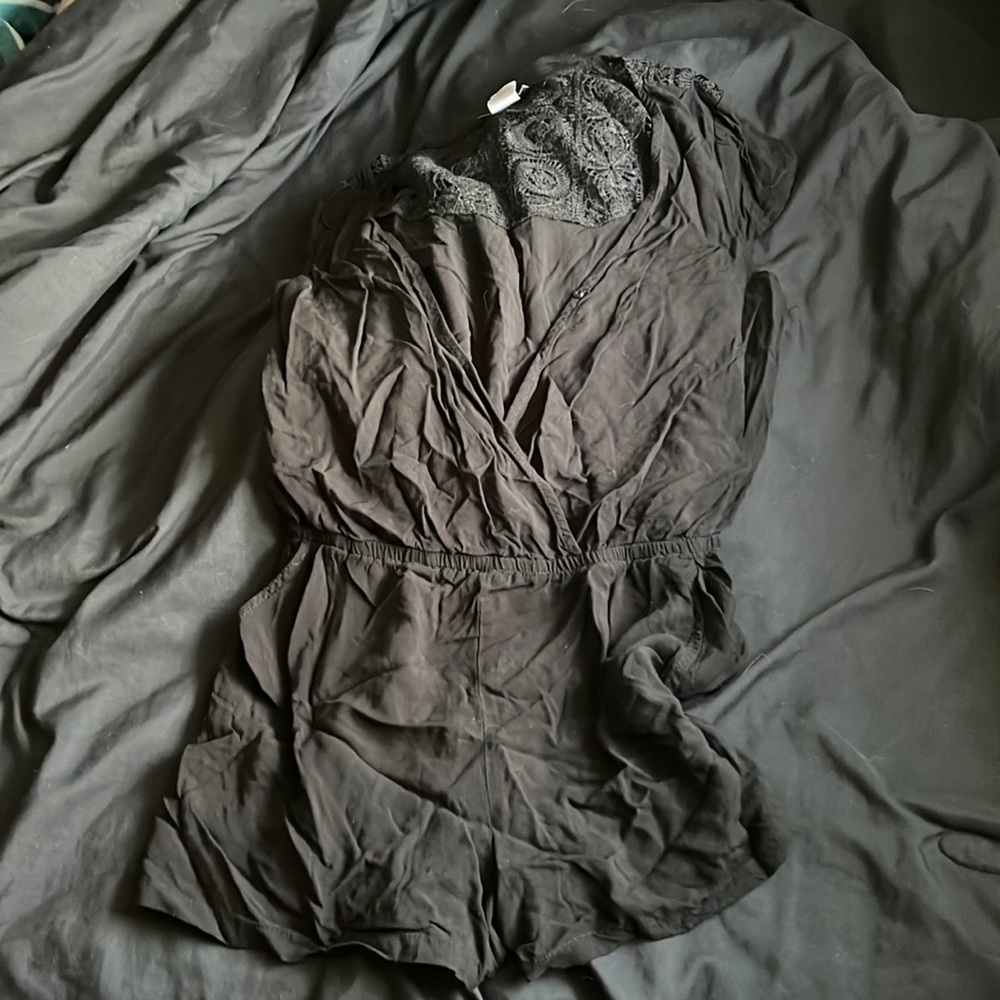 Black romper. Wore twice and it shrank on me